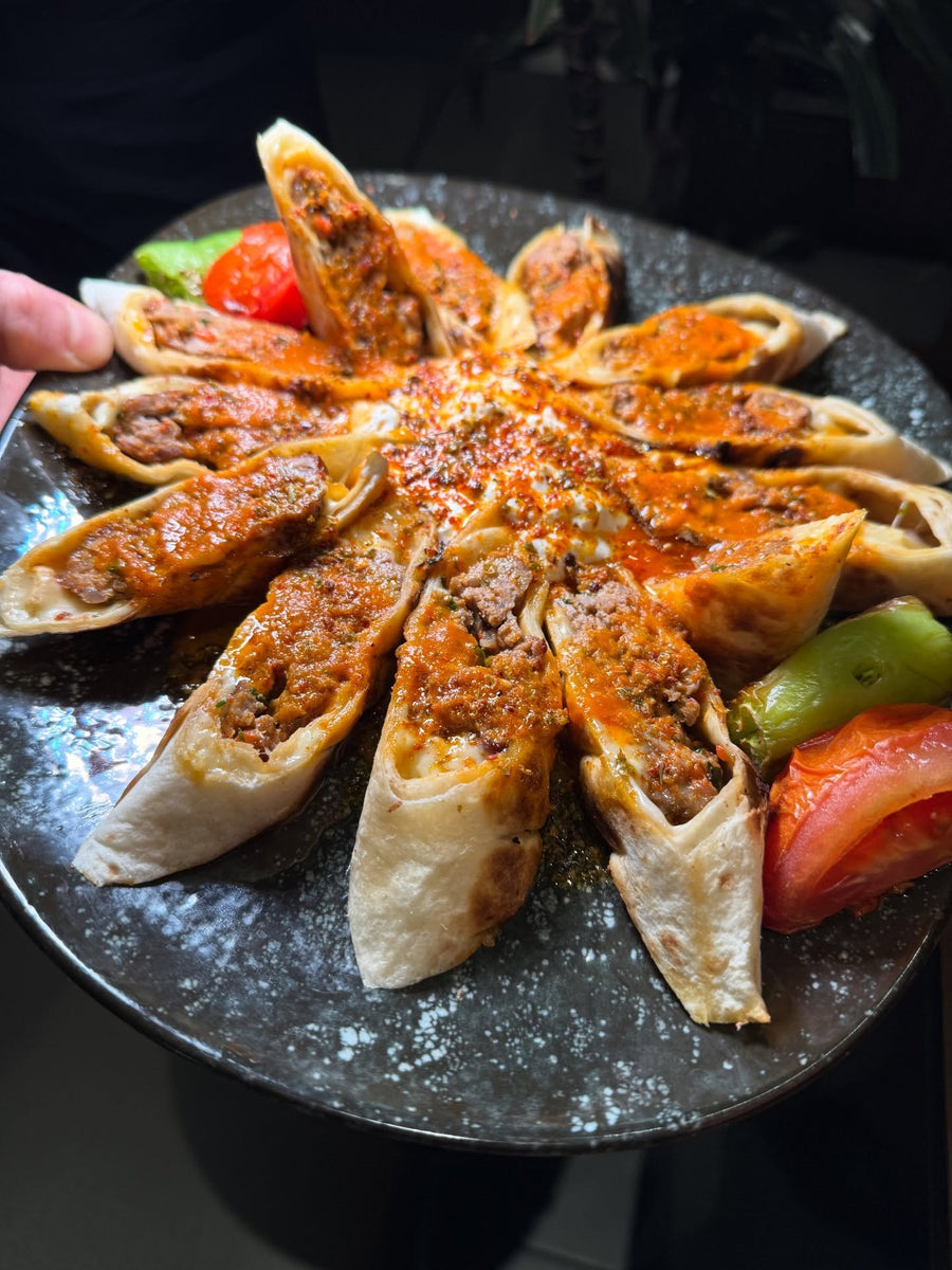 Beyti wraps with tomato sauce and grilled pepper at LARA KITCHEN