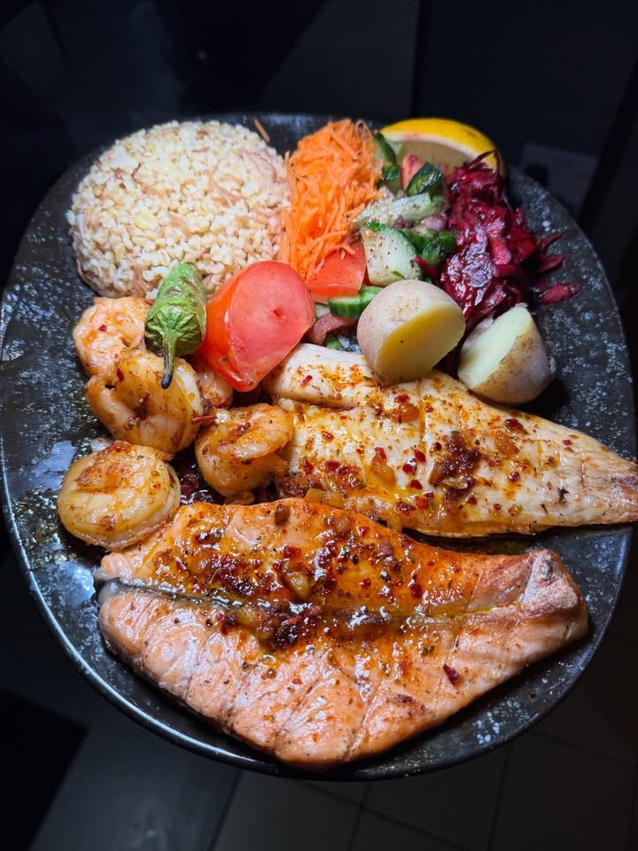 Salmon, sea bass and king prawns with rice at LARA KITCHEN